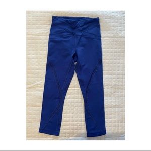 Lululemon Royal Blue cropped leggings with mesh design on front of leg. Size 6